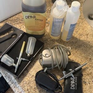 Dinair Airbrush face and body. Gently used